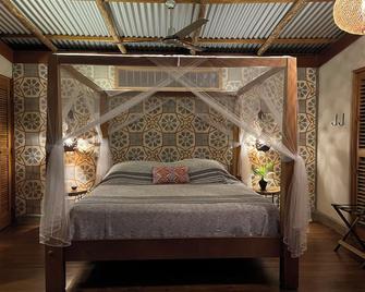 伊瑟勒塔埃斯皮诺生态小屋旅馆 - 格拉纳达 - 睡房