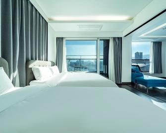 Sokcho E Hotel - 束草 - 睡房