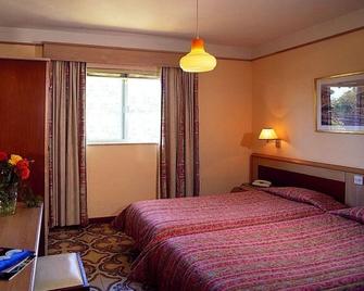 Sundown Court Leisure Resort - 聖瓜安 - 睡房
