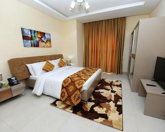 Al Mansour Park Inn Hotel&Apartment - 多哈 - 睡房
