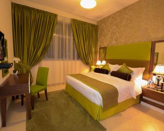 阿尔巴沙瓦利德宫酒店公寓 - 迪拜 - 睡房