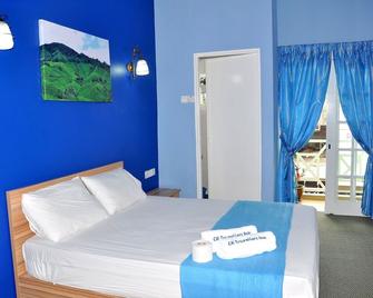 CH Travellers Inn - 金马仑高地 - 睡房