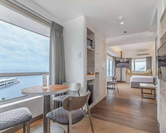 亚洲马尼拉购物中心温德姆 Tryp 酒店 - Pasay - 睡房