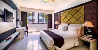 巴厘岛阿斯顿库塔酒店 - 库塔 - 睡房
