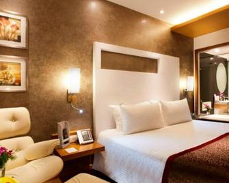 新孟买丽怡酒店及套房 - 纳威孟买 - 睡房
