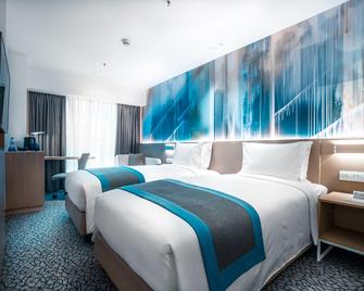 马尼拉纽波特城智选假日酒店 - IHG 旗下酒店 - Pasay - 睡房