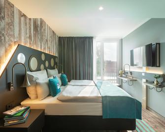 Holiday Inn - the niu, Brass 慕尼黑 奥林匹亚公园 by IHG - 慕尼黑 - 睡房