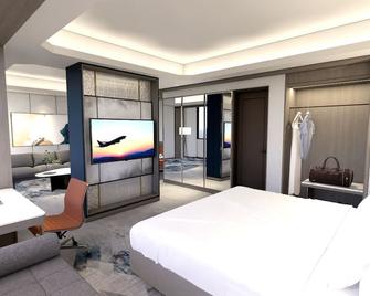 Grand Anara Airport Hotel - 当格浪 - 睡房
