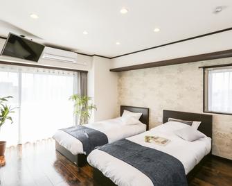 卡纳亚玛度假出租屋酒店 - 名古屋 - 睡房