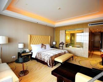 Landbridge Jinjiang Hotel - 日照 - 睡房