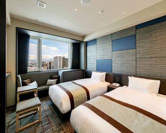由granvia经营的hotel Vischio富山 - 富山 - 睡房