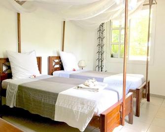 Hotel Jardin de la Paix - 莫罗尼 - 睡房