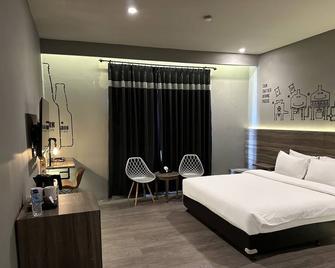 斯塔克精品水疗度假酒店 - 登巴萨 - 睡房