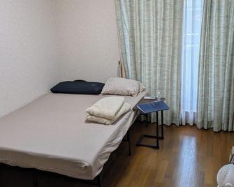 多哥海滩边的私人房间 - 沼津市 - 睡房