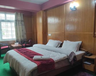 Tawang假期酒店 - Tawang - 睡房