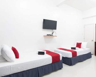 卡加延里塞奥大学附中附近瑞德多兹酒店 - 卡加廷德奥罗 - 睡房