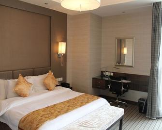 Meiruoshanshui Hotel - 泰安 - 睡房