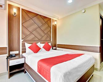 Hotel O Srinivasa Residency - 蒂鲁伯蒂 - 睡房