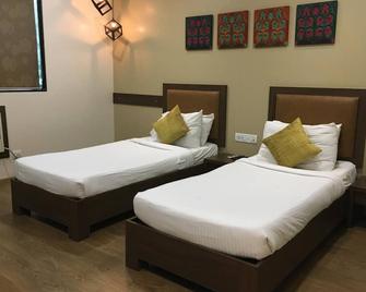 阿米戈酒店 - 孟买 - 睡房
