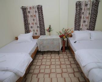 Kirtti Homestay - 古瓦哈蒂 - 睡房