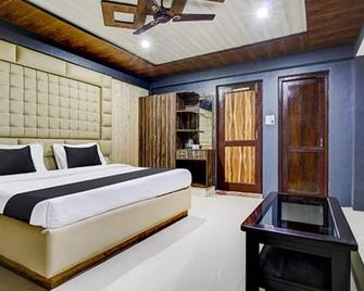 Fabhotel Prime Grand Ali - 斯利那加 - 睡房