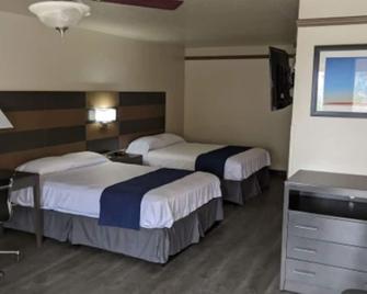 Atrium Inn - 斯托克顿堡 - 睡房