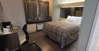 杰克逊城美国最佳价值套房酒店 - 杰克逊 - 睡房