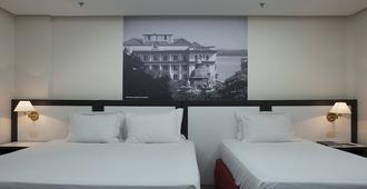尊贵格兰德马斯特酒店 - 阿雷格里港 - 睡房