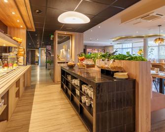 基利雅得卓越瓦纳中心 - 万国宫艺术酒店 - 瓦纳 - 餐馆