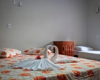 O Pharol Hostel e Pousada - 伊塔卡雷 - 睡房