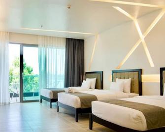 Cube9 Resort and Spa Cube9 度假村和水疗中心 - 拉普拉普市 - 睡房