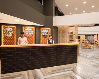 亚美达巴德福姜姜酒店 - 艾哈迈达巴德 - 柜台