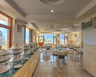雪城面山酒店 - 马纳里 - 餐馆