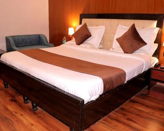 Hotel Rajat Residency Bijnor - 比杰诺尔 - 睡房