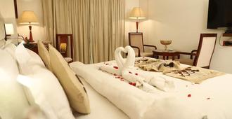 共和国酒店 - 巴特那 - 睡房