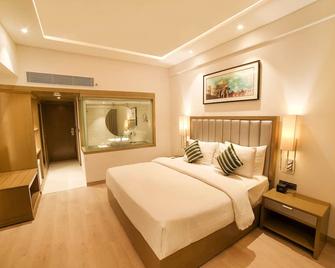 Regenta Place Amritsar 雷吉塔阿姆利则酒店 - 阿姆利则 - 睡房