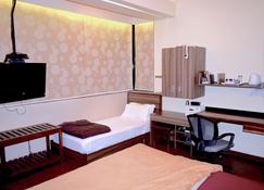 孟买市中心公寓酒店 - 孟买 - 睡房