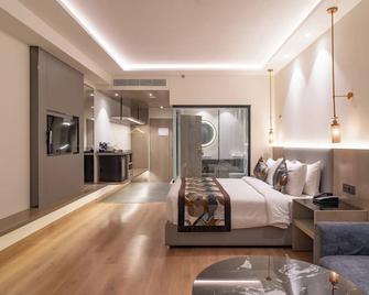 Regenta Place Amritsar 雷吉塔阿姆利则酒店 - 阿姆利则 - 睡房