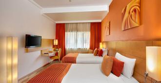 阿尔瓦斯尔奥酷瑞商务酒店 - 迪拜 - 睡房