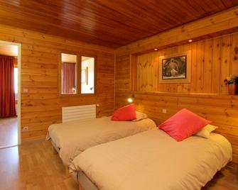 Hotel le Sherpa - 莱德萨阿尔卑斯 - 睡房